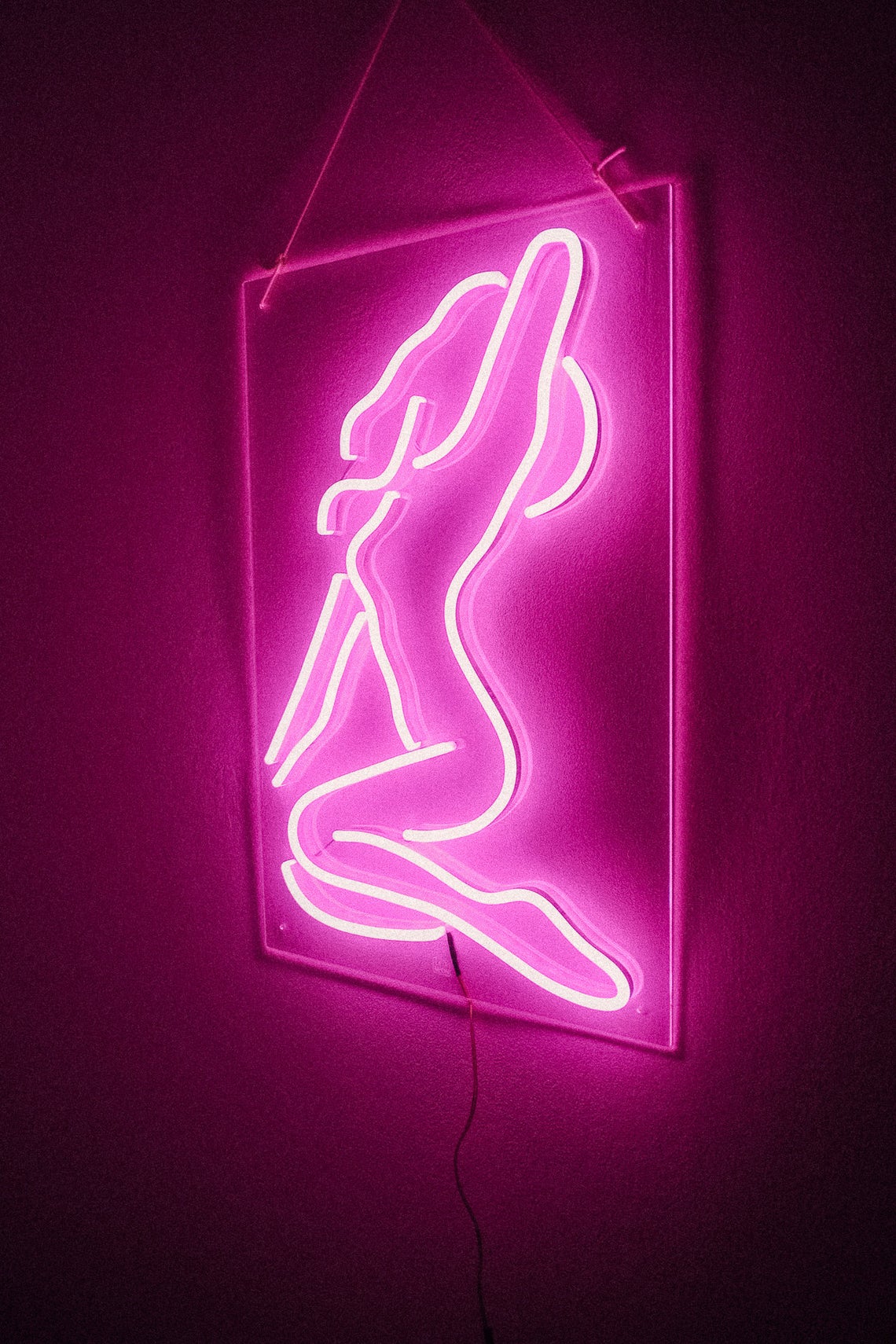 Sexy girl woman pink neon sign for bar, night club, party, erotic striptease