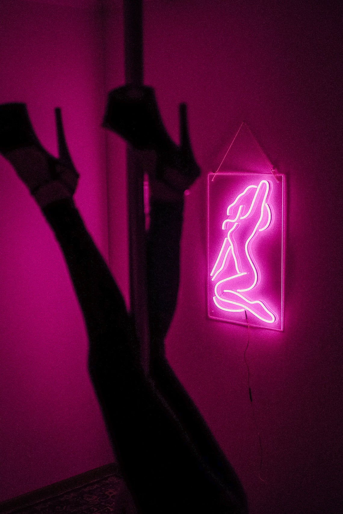 Sexy girl woman pink neon sign for bar, night club, party, erotic striptease